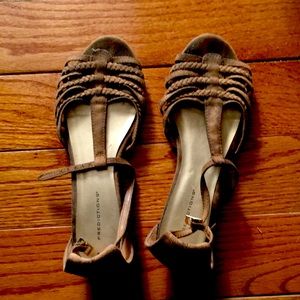 A pair of tan flats shoes